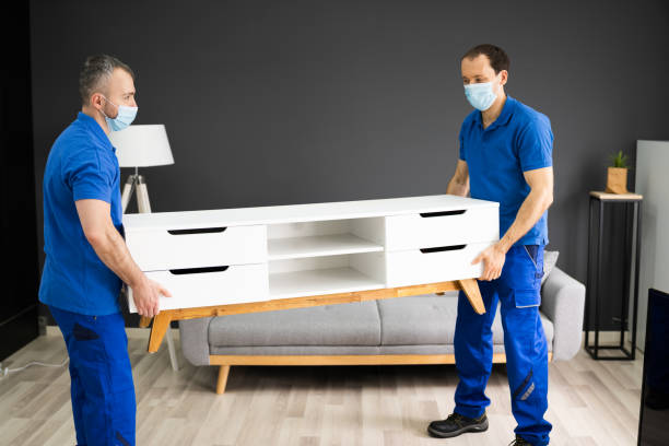 Professional Movers Moving TV Console Furniture In Face Mask